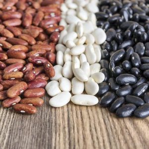multicolored grains beans on wooden table
